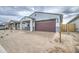 Charming single-story home featuring a brick driveway and two-car garage at 17567 W Adams St, Goodyear, AZ 85338