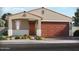 Charming single-story home featuring a two-car garage and desert landscaping at 17567 W Adams St, Goodyear, AZ 85338