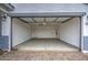 Spacious two-car garage featuring an electric door and concrete floors at 17567 W Adams St, Goodyear, AZ 85338