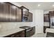 Well-equipped kitchen with granite countertops, stainless steel appliances, and ample cabinet space at 17567 W Adams St, Goodyear, AZ 85338