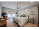 Charming bedroom with neutral color palette, fan, and natural light from the window at 19700 N 76Th St # 1124, Scottsdale, AZ 85255