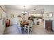 Elegant dining area featuring a chandelier, stylish table setting, and open view into the bright, modern kitchen at 19700 N 76Th St # 1124, Scottsdale, AZ 85255