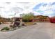 View of the gated entrance to the community with lush landscaping and the community's sign at 19700 N 76Th St # 1124, Scottsdale, AZ 85255