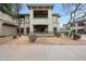 Exterior shot of the home with desert landscaping, including a patio at 19700 N 76Th St # 1124, Scottsdale, AZ 85255