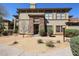 A well-maintained exterior with desert landscaping, stone accents and tiled roof at 19700 N 76Th St # 1124, Scottsdale, AZ 85255