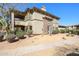 The beautiful exterior features a balcony, stone accents and desert landscaping at 19700 N 76Th St # 1124, Scottsdale, AZ 85255