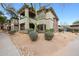 Exterior shot of home with desert landscaping and upper and lower patios at 19700 N 76Th St # 1124, Scottsdale, AZ 85255