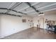 Bright garage with storage racks and epoxy flooring at 19700 N 76Th St # 1124, Scottsdale, AZ 85255