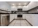 Modern kitchen with stainless steel appliances and white cabinetry at 19700 N 76Th St # 1124, Scottsdale, AZ 85255
