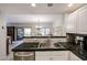 Modern kitchen featuring stainless steel appliances and an open view to the dining area at 19700 N 76Th St # 1124, Scottsdale, AZ 85255