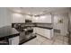 Bright kitchen features white cabinetry, granite countertops, and stainless steel appliances at 19700 N 76Th St # 1124, Scottsdale, AZ 85255