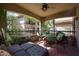 Cozy patio with cushioned seating, metal furniture, plants, and neighborhood views at 19700 N 76Th St # 1124, Scottsdale, AZ 85255