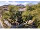 Beautiful home with lush landscaping, mature trees, and a well-manicured lawn at 20897 W Edith Way, Buckeye, AZ 85396