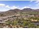 Aerial view showcasing the nearby desert landscape, open space, golf course, and mountains at 20897 W Edith Way, Buckeye, AZ 85396
