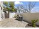 Backyard featuring a built-in BBQ grill, a storage structure for firewood and a lush plant area with decorative rocks at 20897 W Edith Way, Buckeye, AZ 85396
