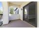A peaceful balcony with a view of the outdoors and a sliding door to the inside at 20897 W Edith Way, Buckeye, AZ 85396