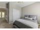 Comfortable bedroom featuring a ceiling fan, a plush bed and a closet at 20897 W Edith Way, Buckeye, AZ 85396