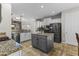 Spacious kitchen with granite countertops, stainless steel appliances, and a central island at 20897 W Edith Way, Buckeye, AZ 85396