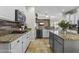 Modern kitchen with granite countertops, stainless steel appliances, and a spacious center island at 20897 W Edith Way, Buckeye, AZ 85396