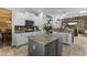 Stylish kitchen featuring granite countertops, stainless steel appliances, and an island with storage at 20897 W Edith Way, Buckeye, AZ 85396