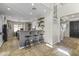 Modern kitchen featuring granite countertops, stainless steel sink, white cabinets, and an open concept design at 20897 W Edith Way, Buckeye, AZ 85396