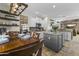 Spacious kitchen with a center island, white cabinets, granite countertops, and an adjacent dining area at 20897 W Edith Way, Buckeye, AZ 85396