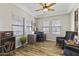Bright home office with wood floors, stylish furnishings, and ample natural light at 20897 W Edith Way, Buckeye, AZ 85396