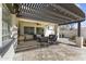 Charming outdoor patio with decorative lights, comfortable seating, and a ceiling fan at 20897 W Edith Way, Buckeye, AZ 85396