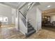 Beautiful staircase leading to the upper level of the home with tile floors at 20897 W Edith Way, Buckeye, AZ 85396
