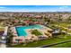 Aerial view of the resort-style community pool with ample seating and shade structures at 22318 S 226Th Pl, Queen Creek, AZ 85142