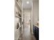 Hallway with shelving leading into a sitting room at 22318 S 226Th Pl, Queen Creek, AZ 85142
