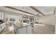 Open kitchen showcasing an island, dining area, and backyard views, seamlessly blending indoor and outdoor living at 22318 S 226Th Pl, Queen Creek, AZ 85142