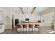 Modern kitchen boasts white cabinetry, granite countertops, and a central island with seating for casual dining at 22318 S 226Th Pl, Queen Creek, AZ 85142