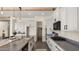 Elegant kitchen featuring modern appliances, a large island with seating, and plenty of cabinet space for storage at 22318 S 226Th Pl, Queen Creek, AZ 85142