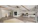Open-concept living space with wood beam accents and a modern design, perfect for entertaining and relaxation at 22318 S 226Th Pl, Queen Creek, AZ 85142