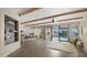 Spacious open-concept living area featuring wood beam ceilings and access to the backyard through sliding glass doors at 22318 S 226Th Pl, Queen Creek, AZ 85142