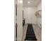 Mud room with dark cabinets and a long rug leading to the exterior door at 22318 S 226Th Pl, Queen Creek, AZ 85142