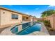 Backyard with a swimming pool, landscaping, and an outdoor cooking area at 22318 S 226Th Pl, Queen Creek, AZ 85142