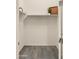 Bright walk-in closet with a shelf and rod system and decorative touches on the shelf at 22318 S 226Th Pl, Queen Creek, AZ 85142
