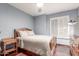 This bedroom features a ceiling fan, wood floors, and a natural wood bed frame at 2321 N Glenview --, Mesa, AZ 85213