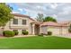 Charming single-Gathering home featuring a manicured front yard with three-car garage and neutral-colored exterior at 2321 N Glenview --, Mesa, AZ 85213