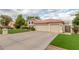 Exterior view featuring a three-car garage, well-manicured lawn, and neutral color palette at 2321 N Glenview --, Mesa, AZ 85213