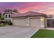 Close up of a three car garage, mature landscaping, and neutral color palette at 2321 N Glenview --, Mesa, AZ 85213