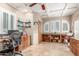 Spacious home office features built-in shelves, shuttered windows, and tile flooring at 2321 N Glenview --, Mesa, AZ 85213
