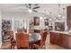 Eat-in kitchen featuring dark wood cabinets, granite countertops, stainless steel appliances, and natural light at 2321 N Glenview --, Mesa, AZ 85213