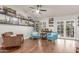 Bright living room showcasing hardwood floors, stylish accent chairs and decor at 2321 N Glenview --, Mesa, AZ 85213