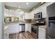 Bright kitchen with stainless steel appliances and ample cabinet space for storage at 26157 W Vista North Dr, Buckeye, AZ 85396