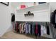 Organized walk-in closet with ample hanging space and shelving for clothing and accessories at 26157 W Vista North Dr, Buckeye, AZ 85396