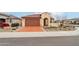 Inviting single-story home with a spacious driveway, low-maintenance desert landscaping, and a two-car garage at 27467 W Osprey Dr, Buckeye, AZ 85396