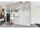 Organized garage featuring a sink, cabinets, and drawers for storage, plus signage and utility hookups at 27467 W Osprey Dr, Buckeye, AZ 85396